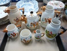 A collection of fox hunting china to include; teapot, jugs, sugar bowl, etc.