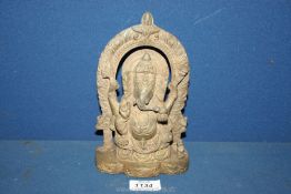 A brass finished statue of Ganesha,