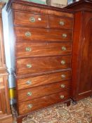 A Mahogany Chest on Chest, the base having three long drawers standing on bracket feet,