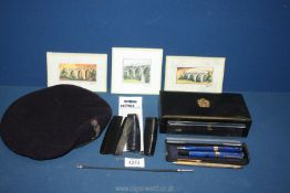 A navy blue beret with Royal Corps signals badge, together with a black box containing pens,