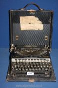 A cased Remington compact portable typewriter.