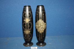 A pair of 20th Century Toleware vases with inlaid decoration. 10" tall.