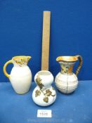 Two Crown Ducal jugs, orange and yellow colours, one having painted leaves on cream ground,