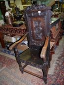 A dark Oak Wainscott/bardic design open armed Armchair,