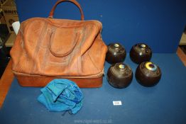 A set of four Lawn Bowls, size 6 and holdall.