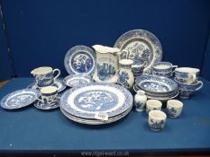 A quantity of blue and white china including plates, Johnson Bros cups and saucers, etc.