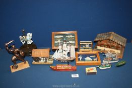 A quantity of miscellanea including small model boats, musical trinket box, matchbox music box, etc.