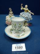 Two miniature Dresden lace dress figures and a pretty cabinet cup and saucer with applied