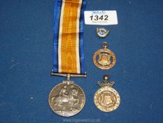 A 1914-1918 War medal with ribbon to 'M21223 Arthur Watson, ACT-ERA.