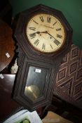 A Miller & Steward Hereford wall clock with Roman numerals, with key and pendulum,