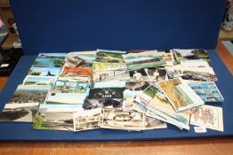 A small quantity of postcards and pictures including steam trains, tennis players etc.