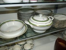A large quantity of Cmielow dinner ware including twelve place settings, graduated platters etc,