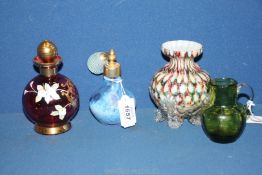 A cranberry coloured scent bottle with applied gilt and porcelain decoration,