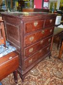 A peg joyned dark Oak Chest on stand having three long and two short drawers with cross-banded