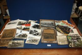 A quantity of black and white photographs of steam tractors, old framed photographs,