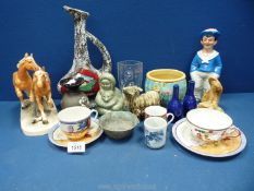 A small quantity of mixed china to include; two horses, a goat, a sailor, tall jug, Oriental trio,