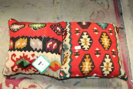 A pair of Afghan Kelim rug cushions, 16" x 16" in red, brown and green colour-way.