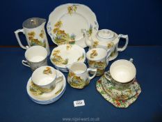 A Royal Winton tea plate and two cups and saucers in "Queen Anne" pattern together with a part