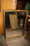 A gold coloured rope twist effect framed rectangular wall mirror with bevelled glass,