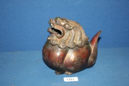 An eastern bronze lion form lidded censer, seal mark to base, approx. 7 1/2" tall x 7 1/4" wide.