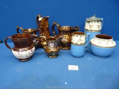 Five gold lustre jugs,