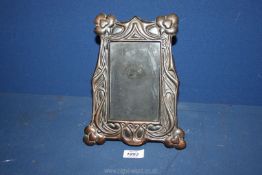 A copper Art Nouveau picture frame, 10" tall.