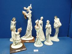 Seven 'Belcari' lady figures, some on wooden plinths.