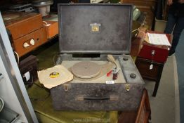 A His Master's Voice record player in brown case, a/f 12'' x 17 1/2'' x 9'' deep.