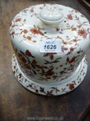 A large Cheese Dome with base in cream gilded china, marked '1 MBH', possibly continental.