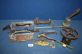 A quantity of metals including hand bell, door handles, letter boxes etc.