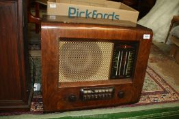 A Bush wooden valve AC radio receiver type PB.12, 22 3/4'' wide x 17 3/4'' high x 12'' deep.