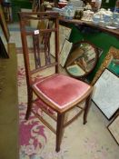 A pretty Edwardian Mahogany side Chair having light-wood stringing and a pink upholstered seat.