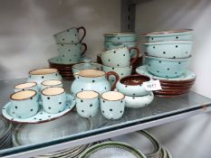 A quantity of Devonshire Pottery breakfast and tea ware including egg cups, soup cups and saucers,