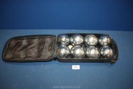 A cased set of 8 Jaques boules in bag.