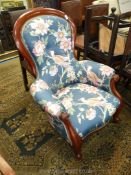 A circa 1900 Mahogany framed buttonbacked Armchair having scroll detailed arms and front legs and