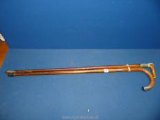 A silver tip walking cane, London maker and an antler handled stick.