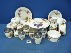 A quantity of Royal Worcester Evesham china including lidded serving dishes, egg coddlers,