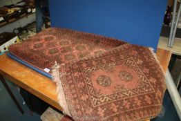 Two small red Bakora mats a/f.