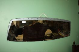A 1950's/60's abstract shaped wall mirror, lebel verso 'Hall's Galvo' Finest quality mirror,