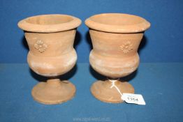 A pair of 19th c. pedestal terracotta Urns, both 5 1/2" tall, one a/f.