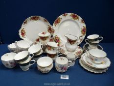 A quantity of china including Derby Posies teacups, Wedgwood coffee cups and saucers,