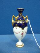 A miniature Coalport baluster vase painted with garlands of flowers and cobalt blue (4 1/2 tall).