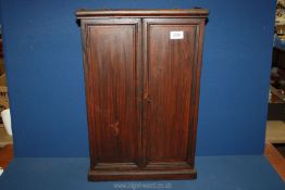 A darkwood table top Cabinet/Wall unit fitted with hooks and shelf possibly for medicine, with key,