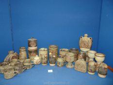 A large quantity of 1970's Tremar pottery to include; canisters, goblets, flasks, etc.