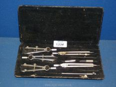 A cased set of drawing instruments, drafting set.