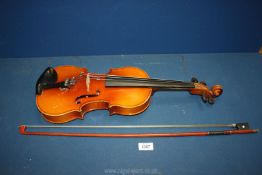 A cased 'Lark' Violin and bow only having three strings (one missing);