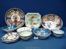 A quantity of oriental china including large bowl, dishes, plates etc.