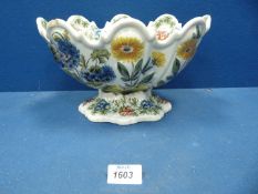 A 19th c. Nove faience large Monteith painted with flowers, some wear, 11" wide x 6 1/2" tall.