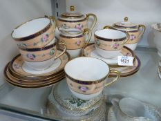 A Noritake tea set for four (one cup chipped),