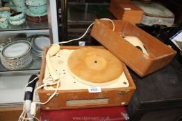 A Barbieri portable record player in brown case with insert speaker in the lid,